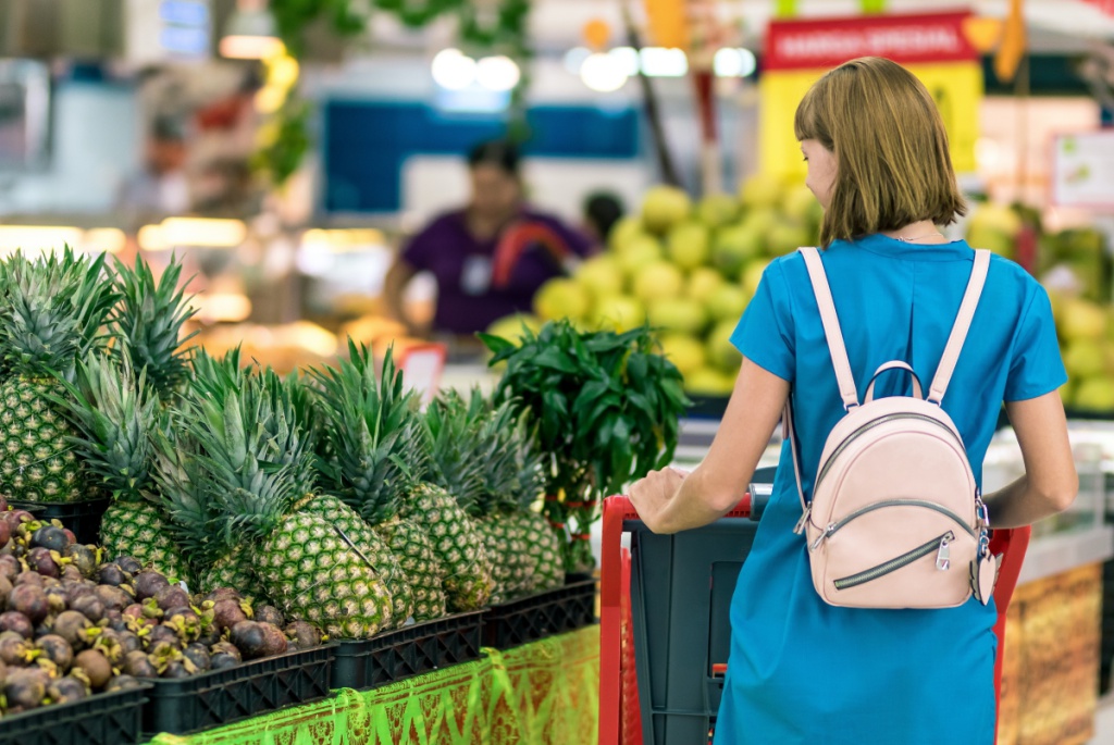 woman-standing-beside-pineapple-fruits-2292919.jpg